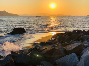 Scenic view of sea against sky during sunset