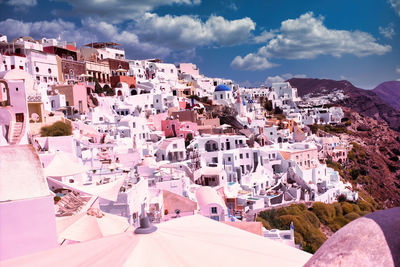 Santorini, greece - wide angle cityscape of white houses and blue domes of the churches