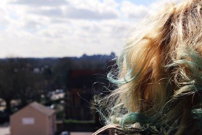 Close-up of woman against sky