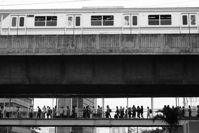 People at train against sky