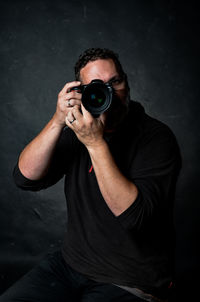 Man photographing with camera