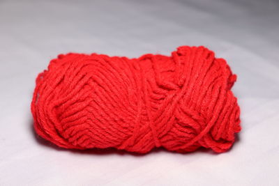 Close-up of red leaf against white background