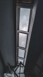 Low angle view of window in abandoned house