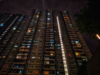 Low angle view of illuminated buildings at night