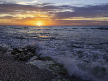 Scenic view of sea against sky during sunset