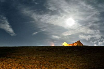 Built structure on field against sky