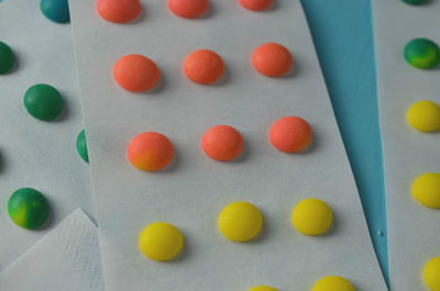 Old fashioned button candy on white strips of paper