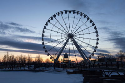 Old montreal great wheel and bridge with sunrise reflection in cabin, montreal, quebec, canada