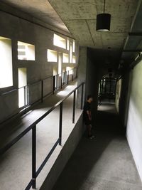 Full length of woman walking in corridor