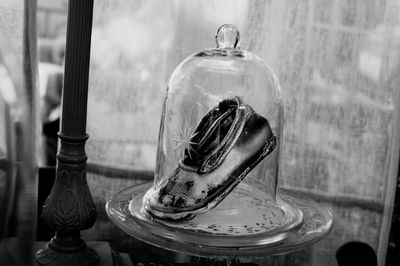 Close-up of old glass bottle on table