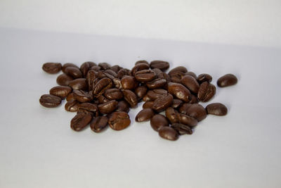 Close-up of roasted coffee beans on table