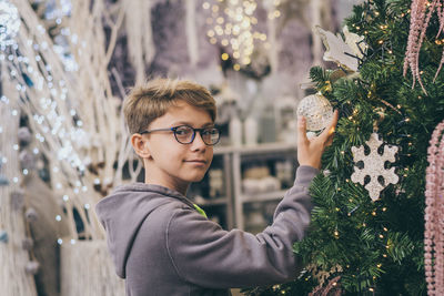 Portrait of boy with christmas tree