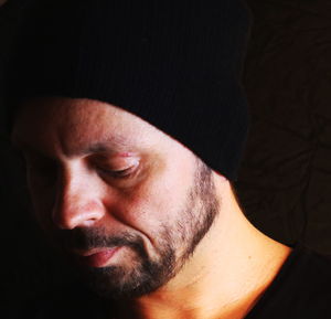 Close-up of bearded man wearing knit hat