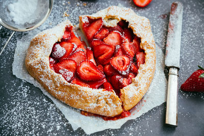 High angle view of strawberry tart on table