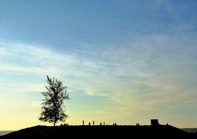 Silhouette of trees against sky at sunset