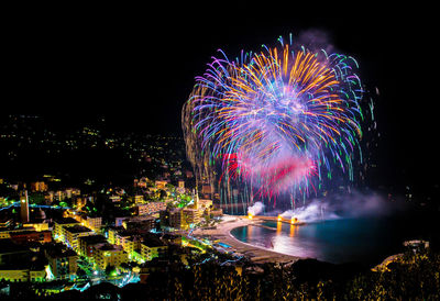 Firework display at night