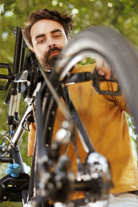 Low angle view of man sitting on wheelchair