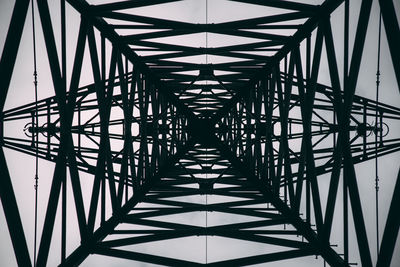 Low angle view of metallic structure against sky