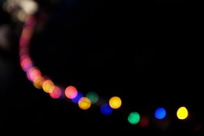 Defocused image of illuminated lights at night