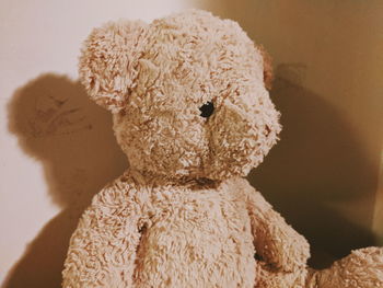 Close-up of stuffed toy against gray background