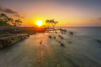 Scenic view of sea against sky during sunset
