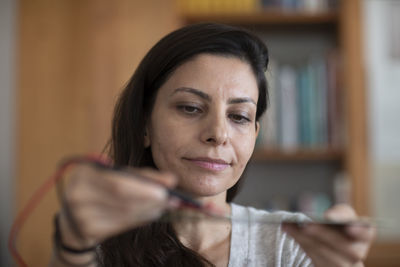 Student female testing a sample in a room