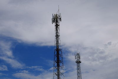 Low angle view of communications tower against sky