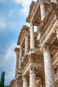 Low angle view of old temple against sky