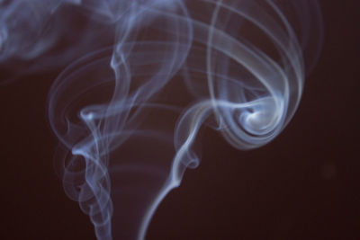 Close-up of smoke against black background