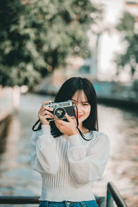 Young woman photographing