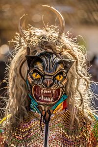 Close-up of woman wearing mask at event