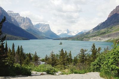 Scenic view of lake and mountains against sky