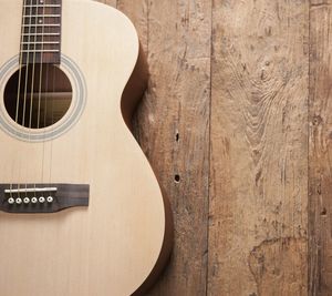 Close-up of guitar on wooden table