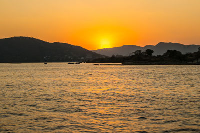 Scenic view of sea against sky during sunset