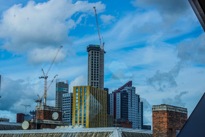Low angle view of modern buildings against sky