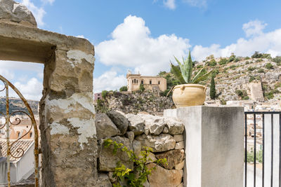 Low angle view of old ruins against sky