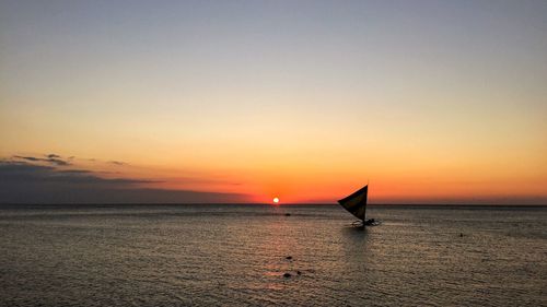 Scenic view of sea at sunset