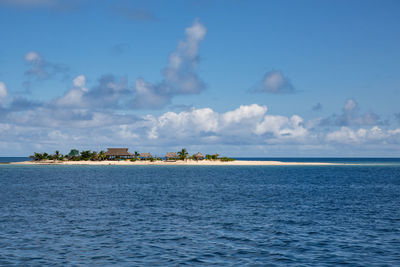 Scenic view of island in the sea against sky