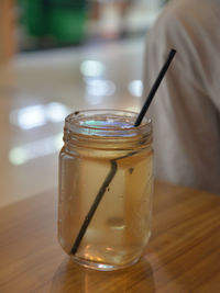 Close-up of glass of jar on table