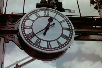 Low angle view of clock tower against sky