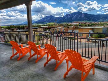 Chairs and tables against sky