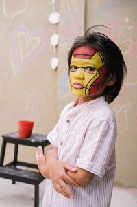 Close-up of asian boy with ironman facepaint