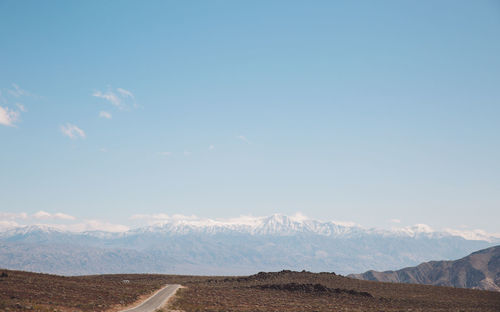 Scenic view of landscape against blue sky