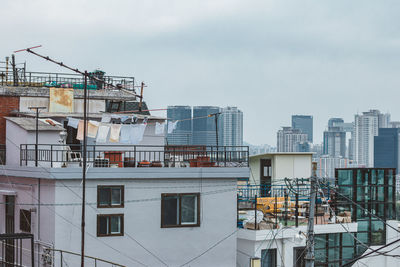 High angle view of buildings against sky in city