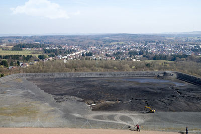 High angle view of crowd on landscape against sky