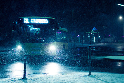 Illuminated street during winter at night