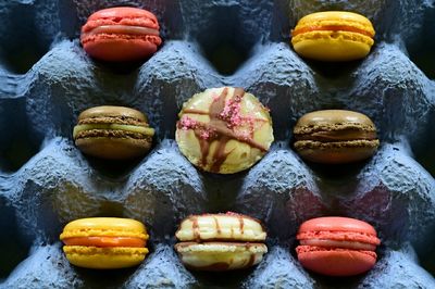 High angle view of macaroons in crate