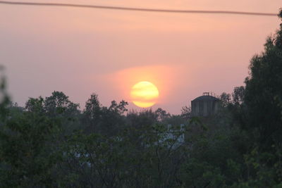 Scenic view of landscape against sky at sunset