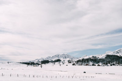 Scenic view of snow covered mountains against sky