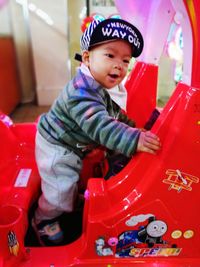 Cute girl playing with toy car